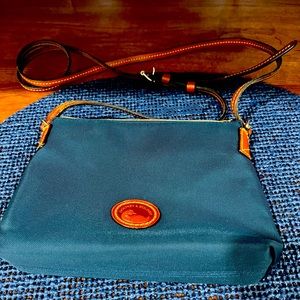 Dooney & Bourke blue crossbody with leather trim zipper close, adjustable strap
